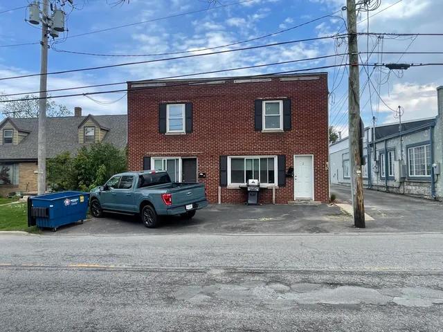 a car parked in front of a house