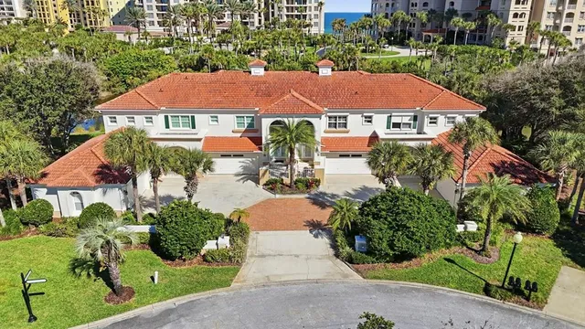 a living room with furniture and view of kitchen