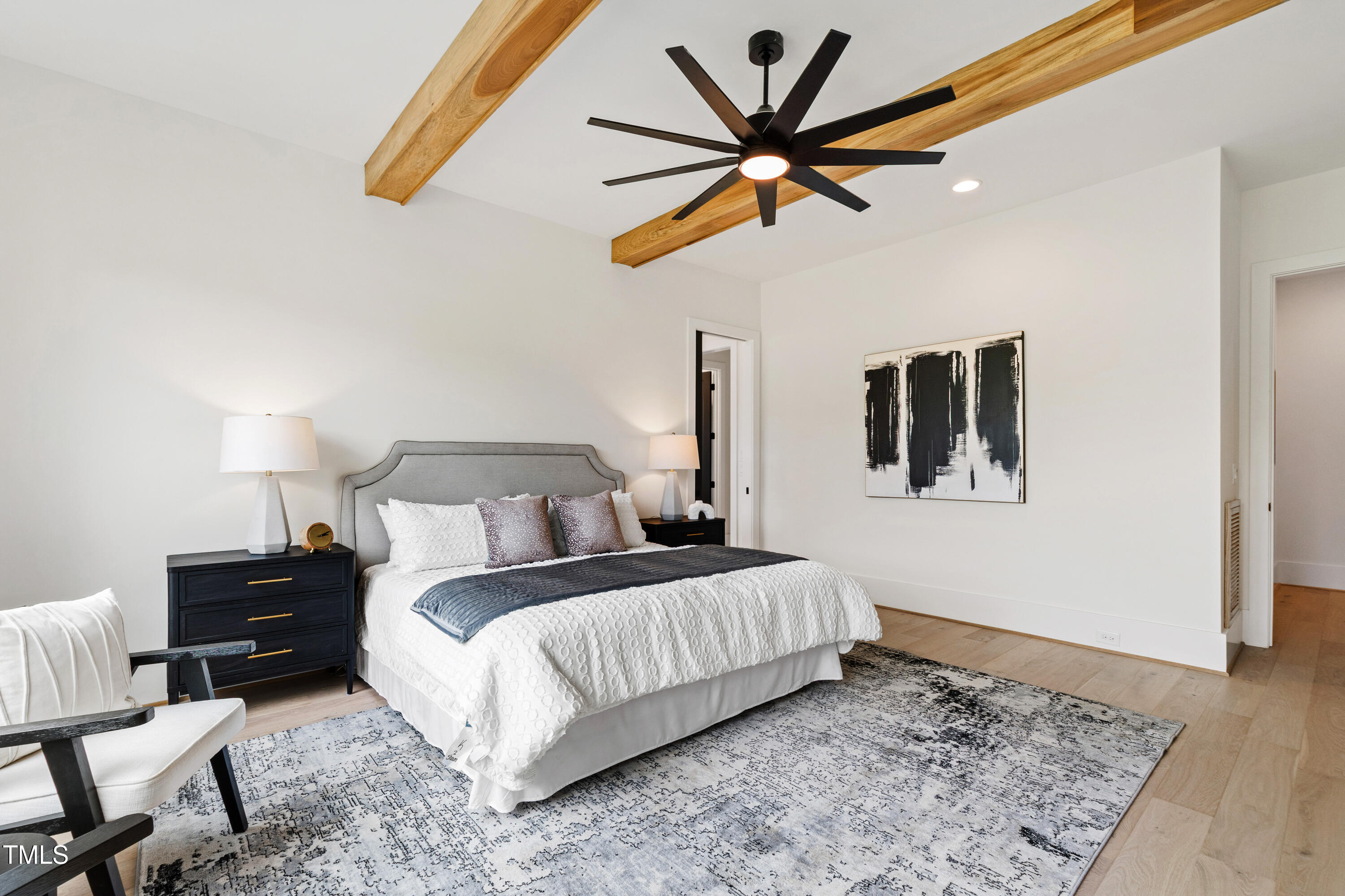 280 Forest Bridge Road Franklinton, NC 27525 - Photo 14 of 65 a bedroom with a bed and a chandelier