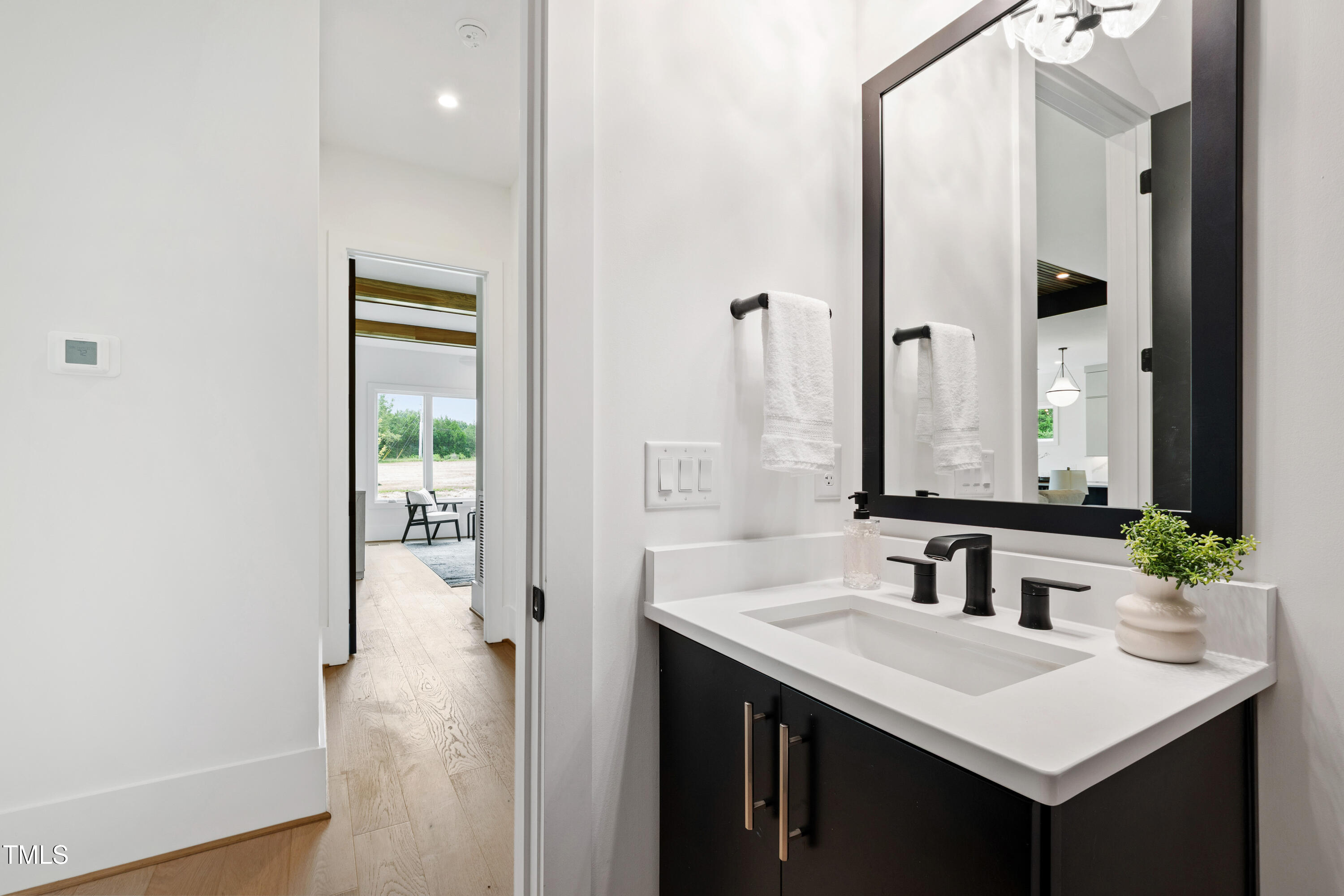 280 Forest Bridge Road Franklinton, NC 27525 - Photo 45 of 65 a bathroom with a sink and a mirror
