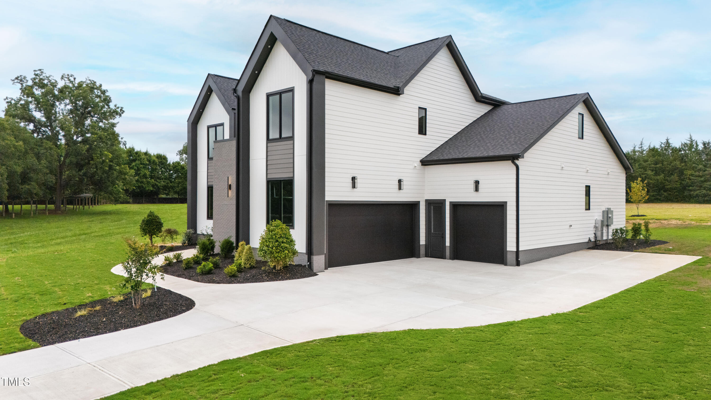 280 Forest Bridge Road Franklinton, NC 27525 - Photo 56 of 65 a front view of a house with garden