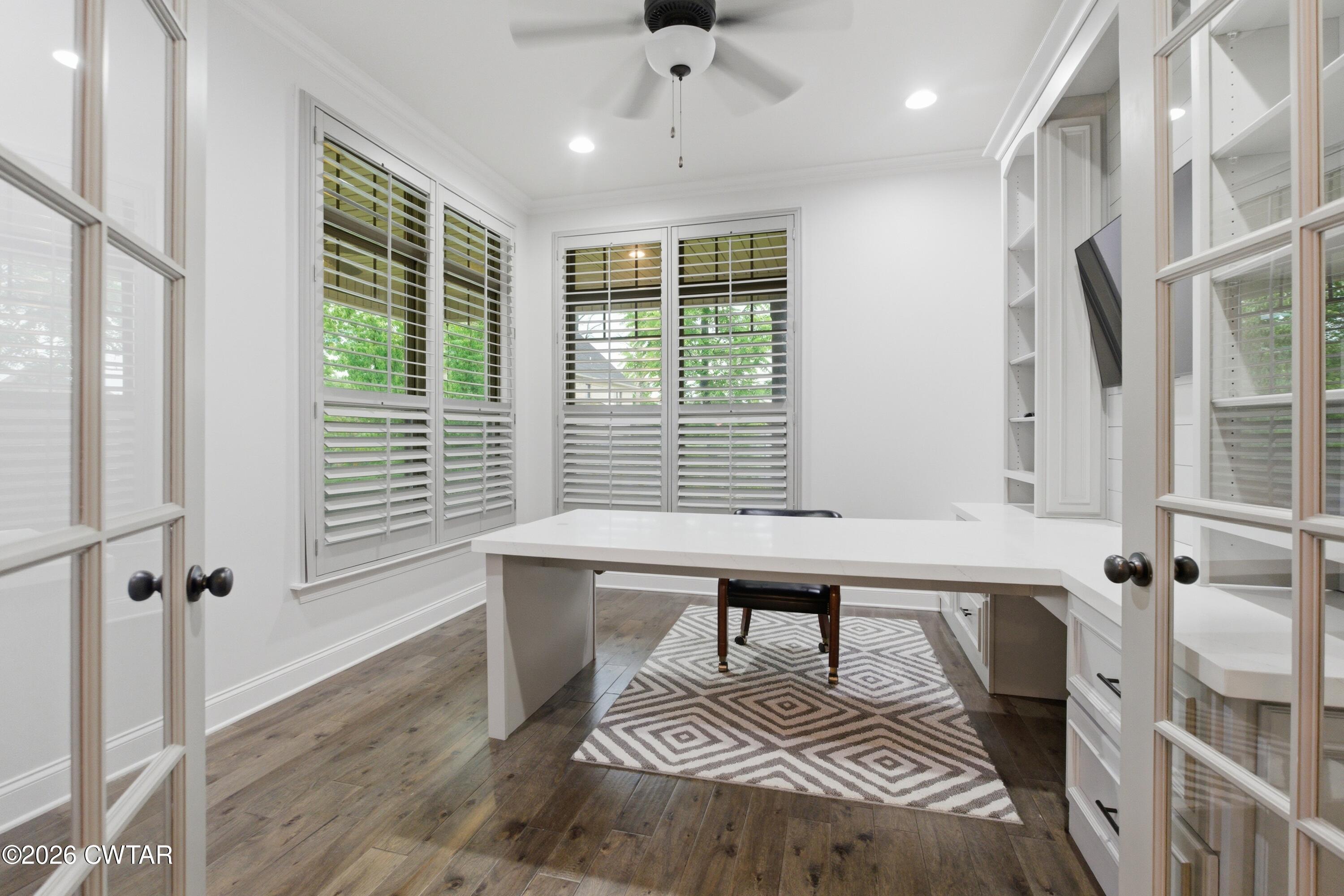 963 Ashport Road Jackson, TN 38305 - Photo 17 of 60 a view of a bedroom with furniture window and wooden floor