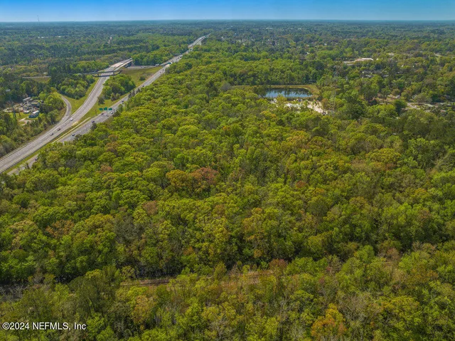 a view of a field with an ocean view