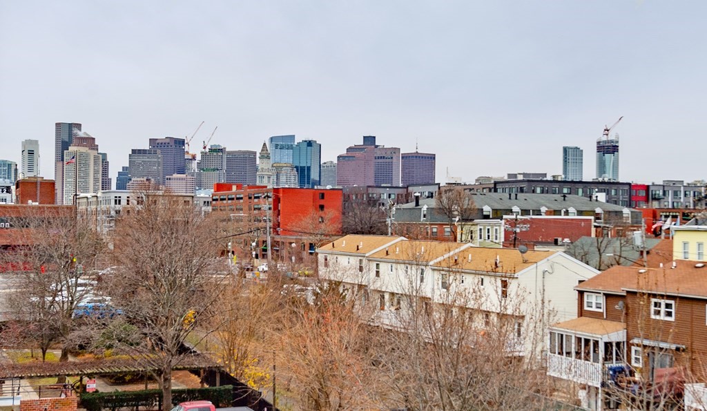 167 Maverick Street Boston, MA 02128 - Photo 2 of 11 a view of a city with tall buildings