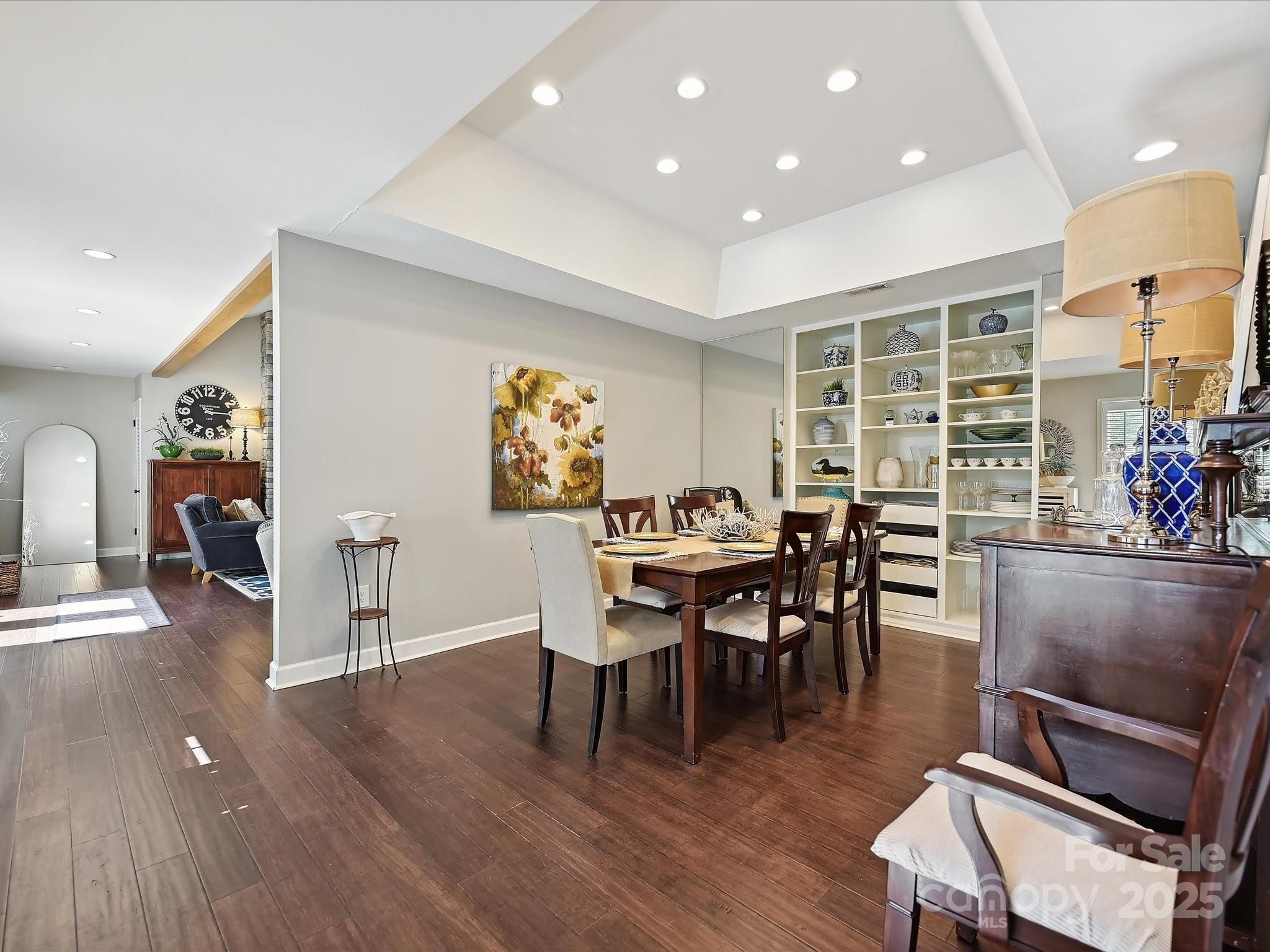 169 Spring Run Road Mooresville, NC 28117 - Photo 12 of 41 a view of a dining room with furniture and wooden floor