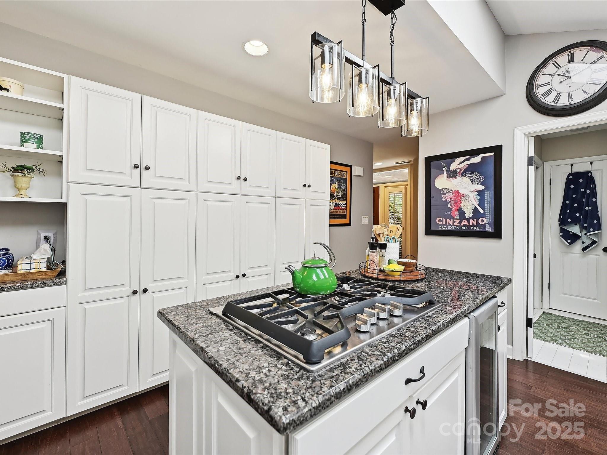 169 Spring Run Road Mooresville, NC 28117 - Photo 15 of 41 a kitchen with kitchen island granite countertop a stove a cabinets and wooden floor