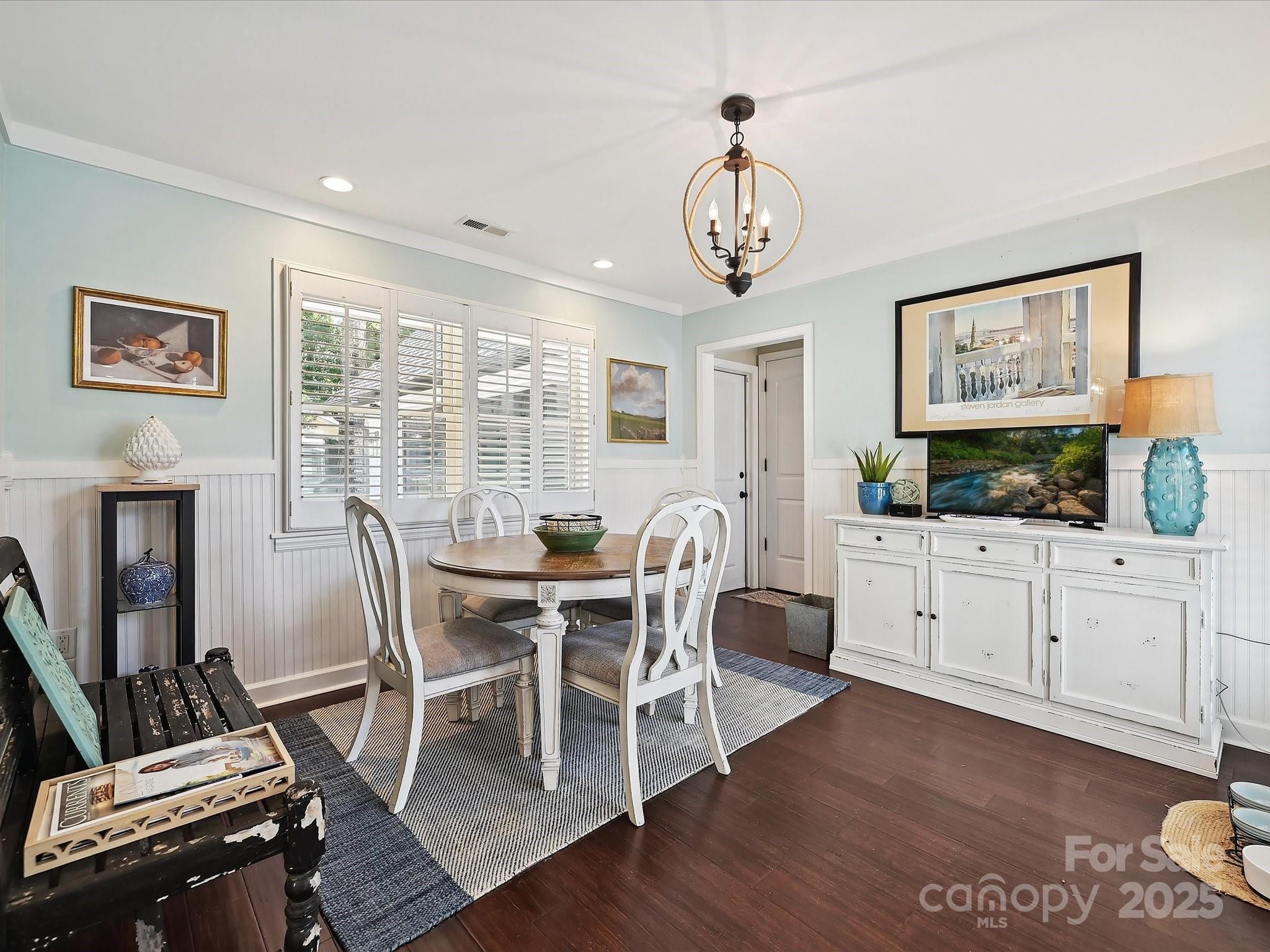169 Spring Run Road Mooresville, NC 28117 - Photo 18 of 41 a view of a dining room with furniture window and wooden floor