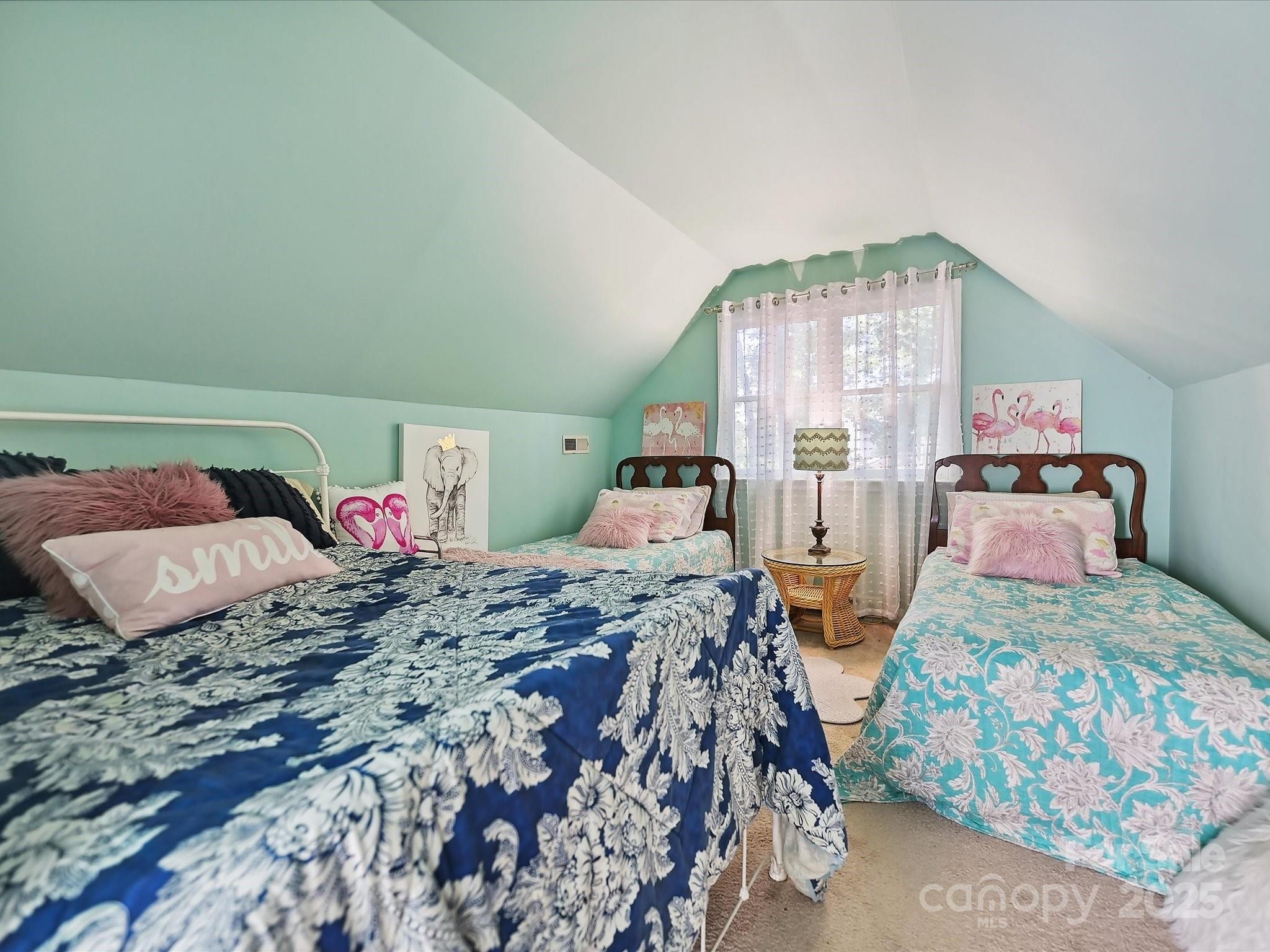 169 Spring Run Road Mooresville, NC 28117 - Photo 32 of 41 a bedroom with two beds and a large window