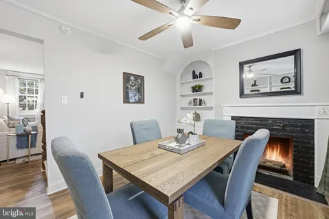 a view of a dining room with furniture wooden floor and a chandelier