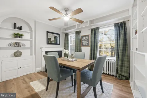 a view of a dining room with furniture and window