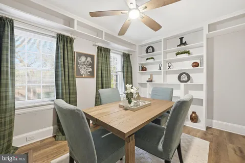 a view of a dining room with furniture and window