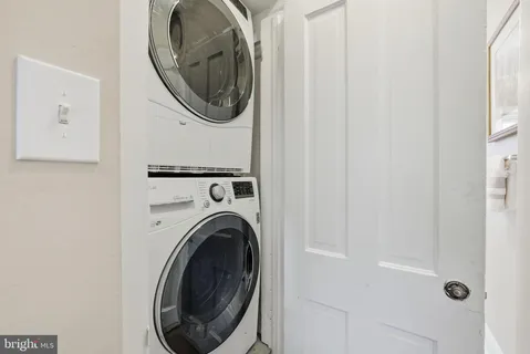 a view of a hallway with washer and dryer