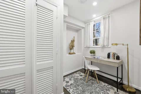 a work room with furniture and window