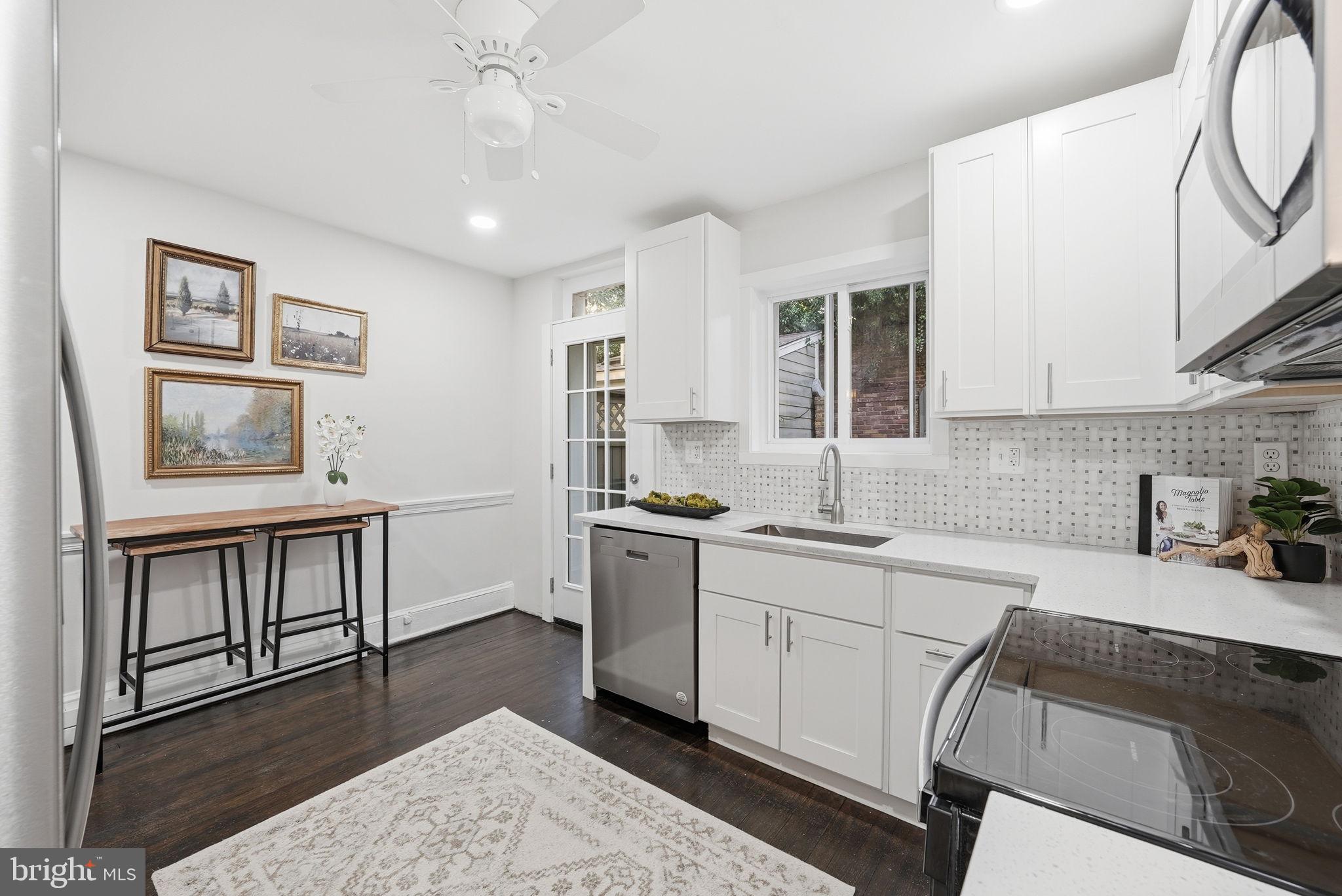 1544 34th Street Northwest Washington, DC 20007 - Photo 8 of 26 Kitchen flows to charming garden.