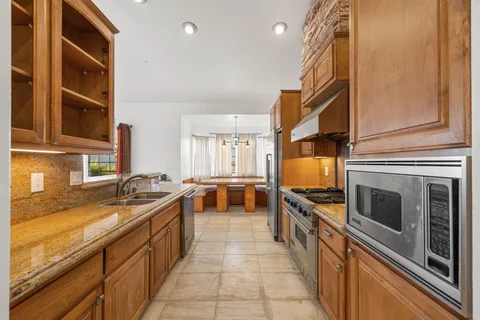 a kitchen with a sink and a window
