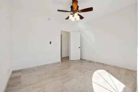 a spacious bathroom with a double vanity sink toilet and shower