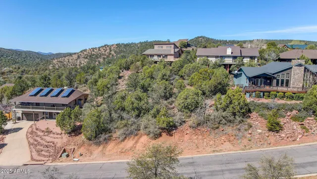 an aerial view of houses with a yard