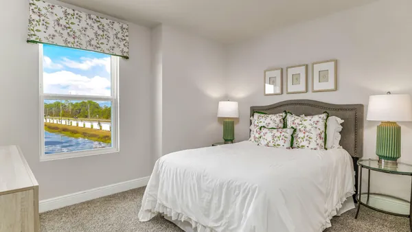 a bedroom with a bed and night stand