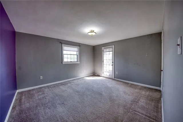 a view of empty room with windows