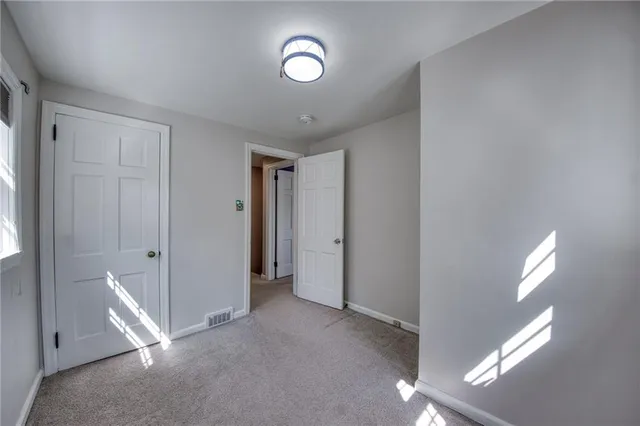 a view of a livingroom with wooden floor