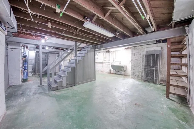a view of empty room with wooden ceiling