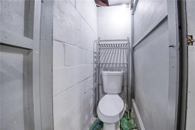 a bathroom with a toilet and a sink