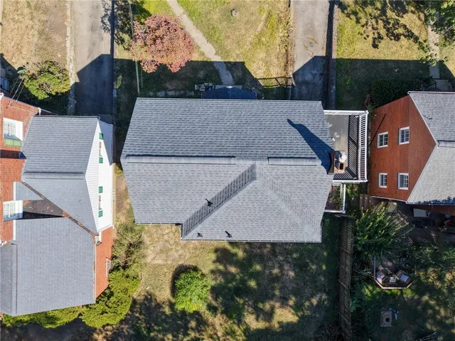 an aerial view of houses with yard