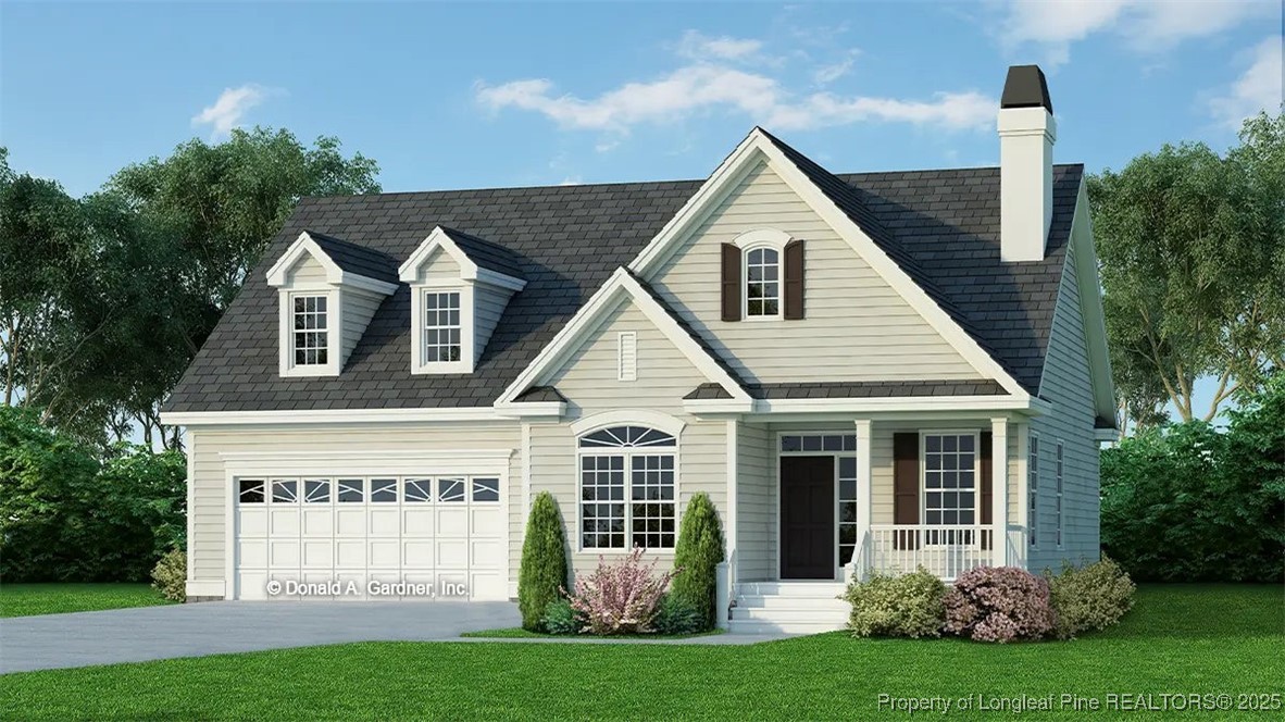 a view of a house with garden and yard