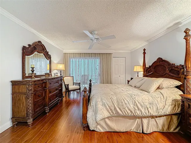 a bed room with a bed and a tv