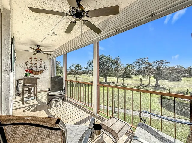 a view of a balcony with chairs