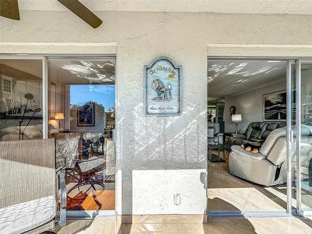 a living room with furniture and painting on the wall