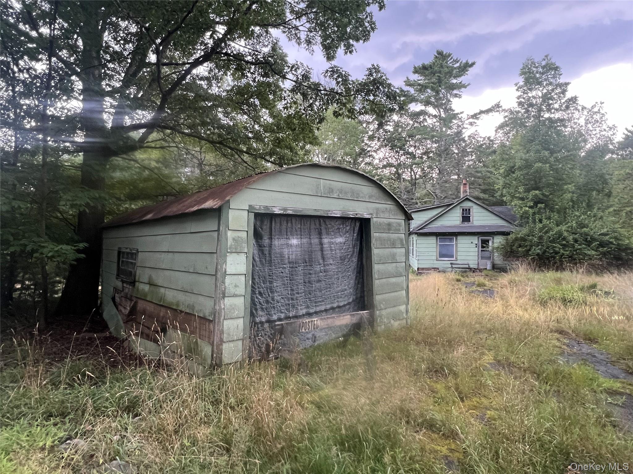 259 Lackawaxen Road Narrowsburg, NY 12764 - Photo 32 of 34 a backyard of a house with lots of green space