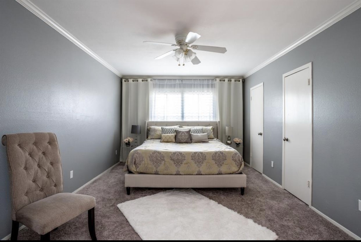 2228 South Piney Point Road, Unit 101 Houston, TX 77063 - Photo 7 of 8 a bedroom with a bed and window