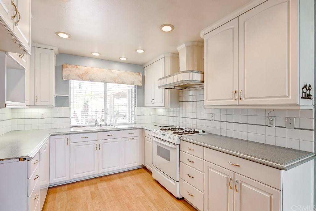 24001 Crescent Road Lake Forest, CA 92630 - Photo 1 of 1 Fresh, white cabinetry is a feature of this light and bright kitchen.