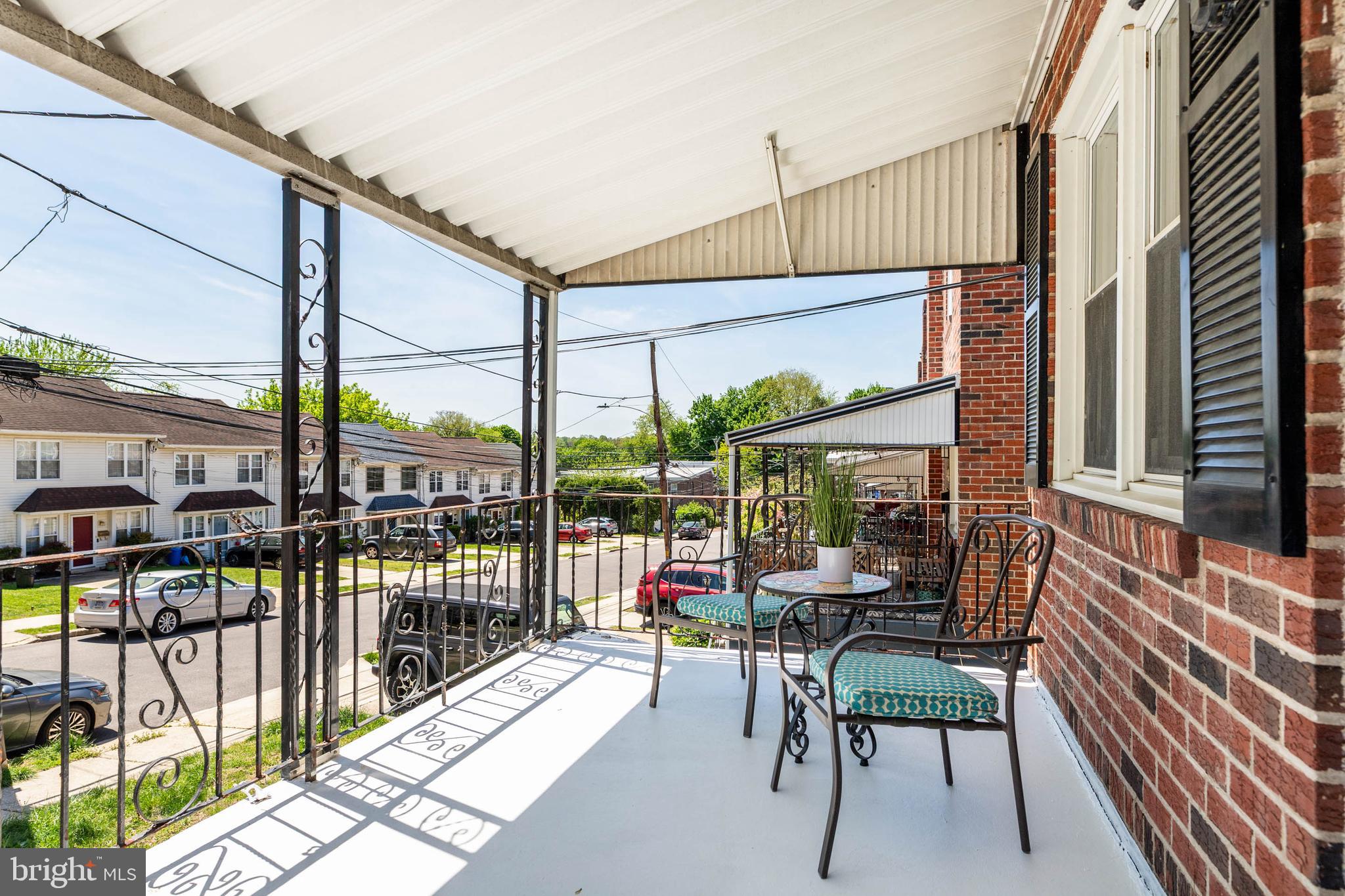 318 Ripka Street Philadelphia, PA 19128 - Photo 2 of 24 a view of a patio with a table chairs and a balcony