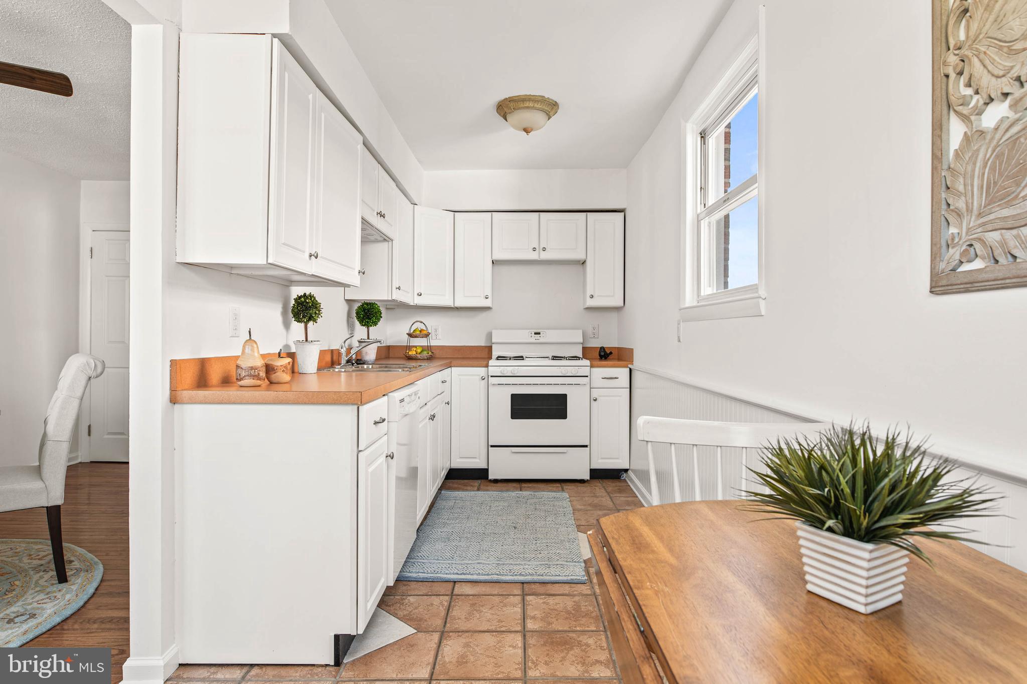 318 Ripka Street Philadelphia, PA 19128 - Photo 9 of 24 a kitchen with white cabinets and white appliances