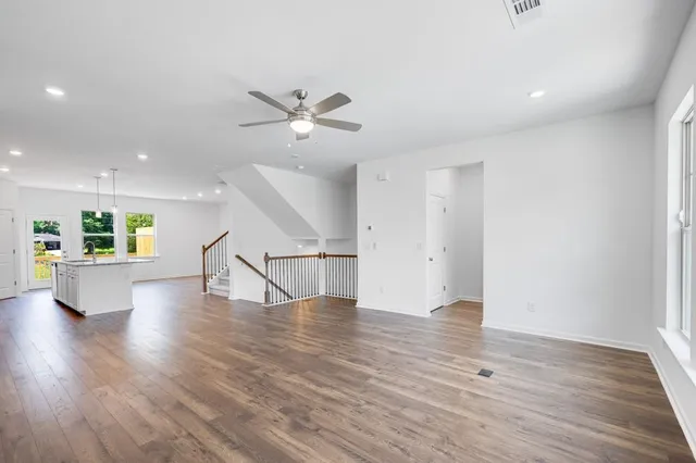 a view of kitchen with wooden floor and electronic appliances