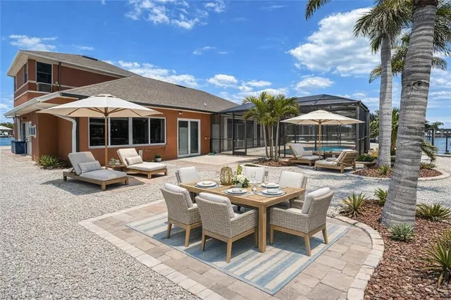 a view of a balcony with chairs and wooden floor
