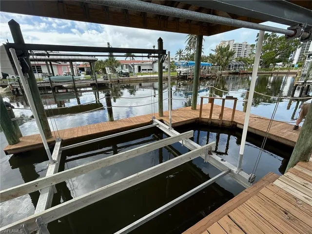 a large kitchen with stainless steel appliances granite countertop a lot of counter space and wooden floors