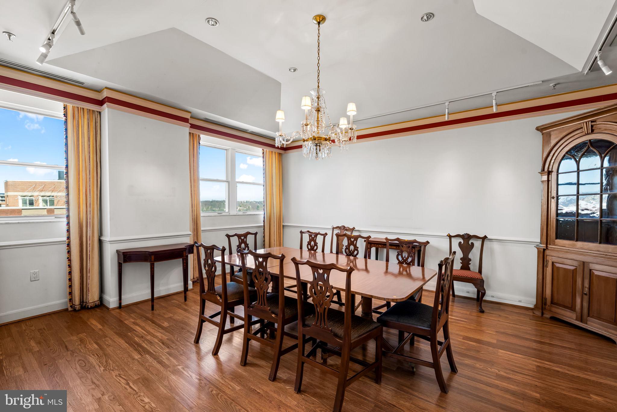 3801 Canterbury Road, Unit 1104 Baltimore, MD 21218 - Photo 16 of 74 a view of a a dining room with furniture window and wooden floor