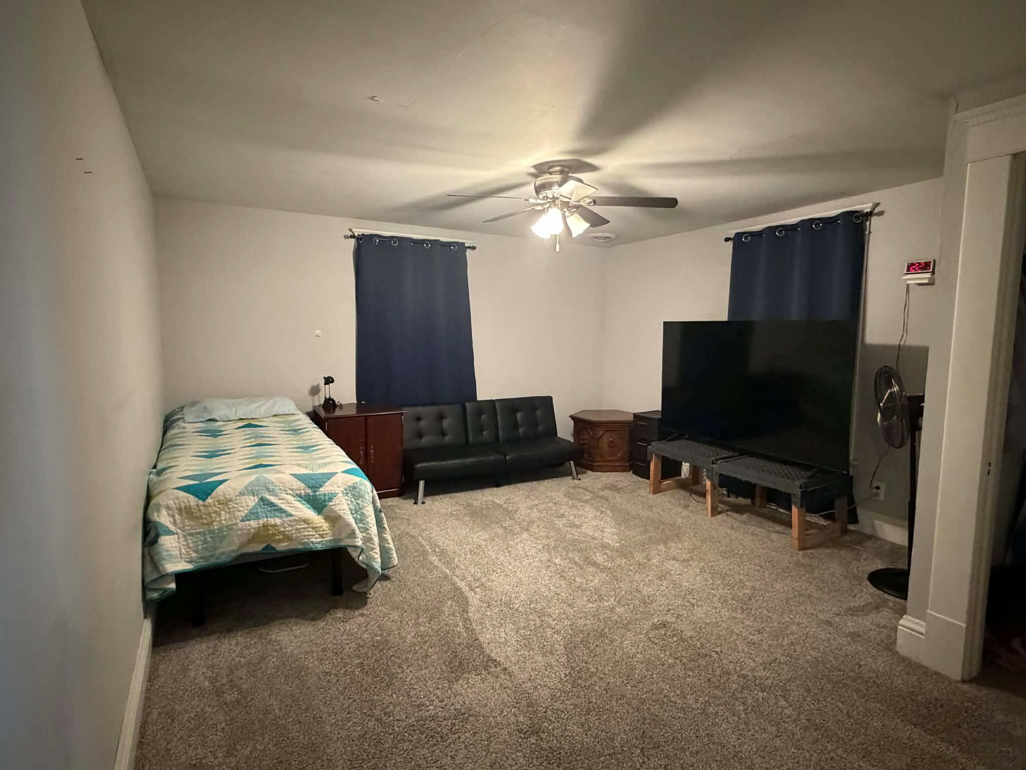 320 South Cullen Street Rensselaer, IN 47978 - Photo 18 of 23 a living room with furniture and a flat screen tv