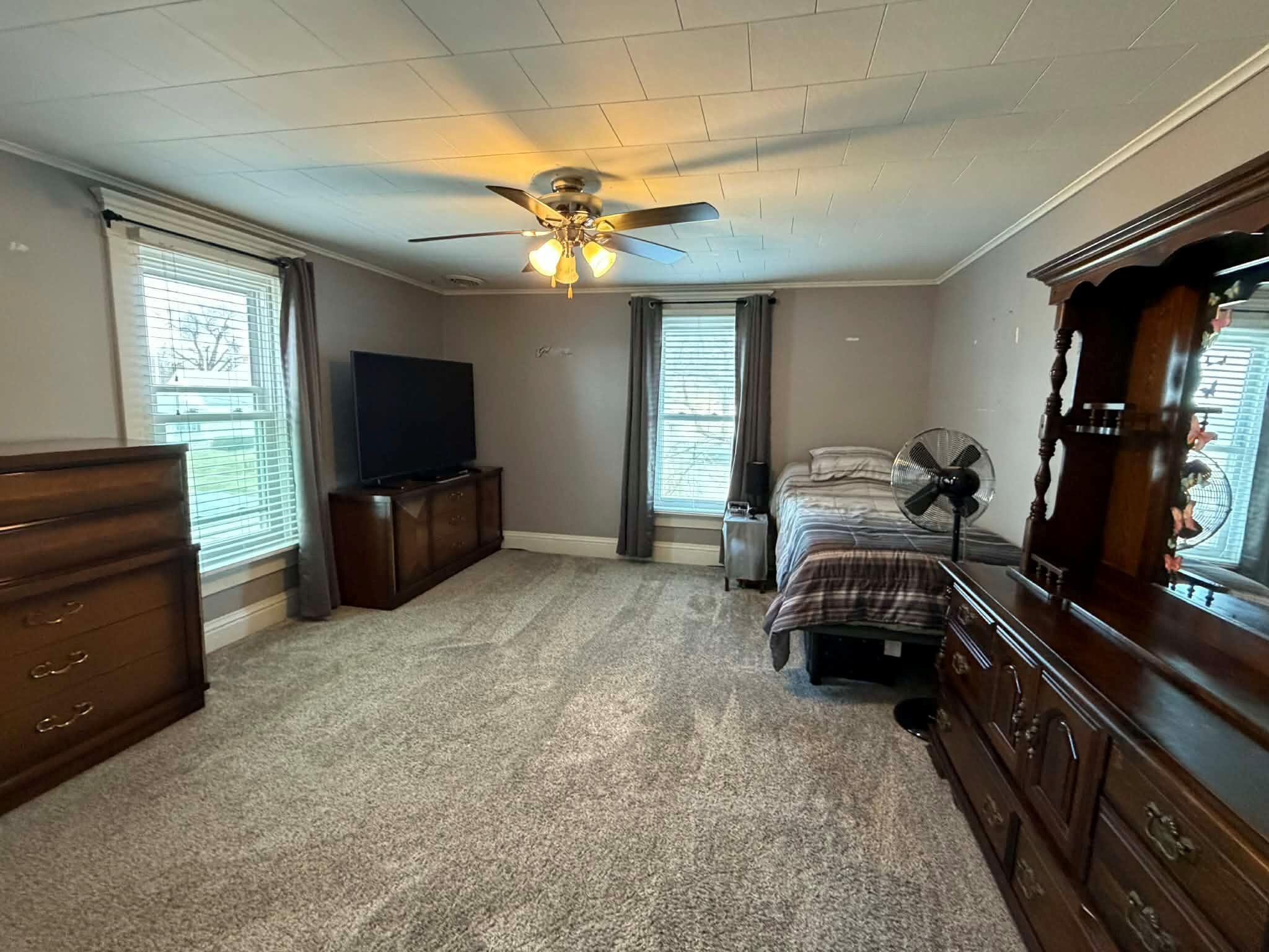 320 South Cullen Street Rensselaer, IN 47978 - Photo 20 of 23 a living room with furniture and a flat screen tv