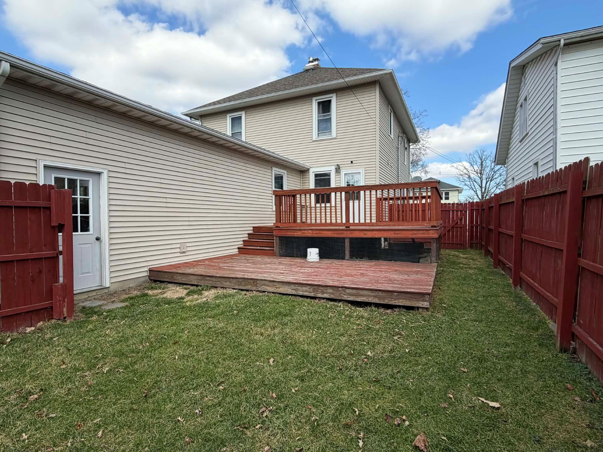 320 South Cullen Street Rensselaer, IN 47978 - Photo 2 of 23 a view of a house with a yard and deck