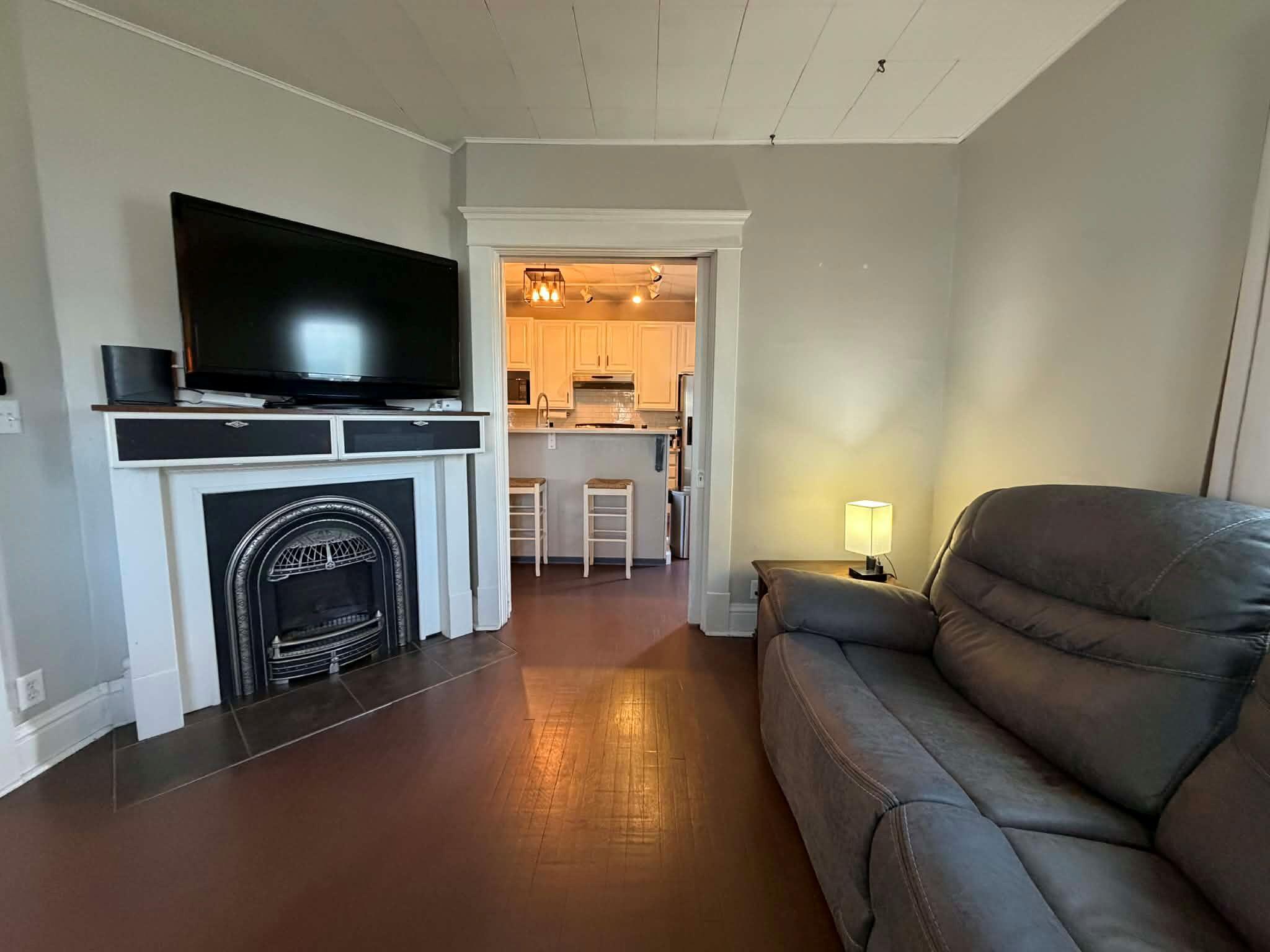320 South Cullen Street Rensselaer, IN 47978 - Photo 7 of 23 a living room with furniture and a flat screen tv
