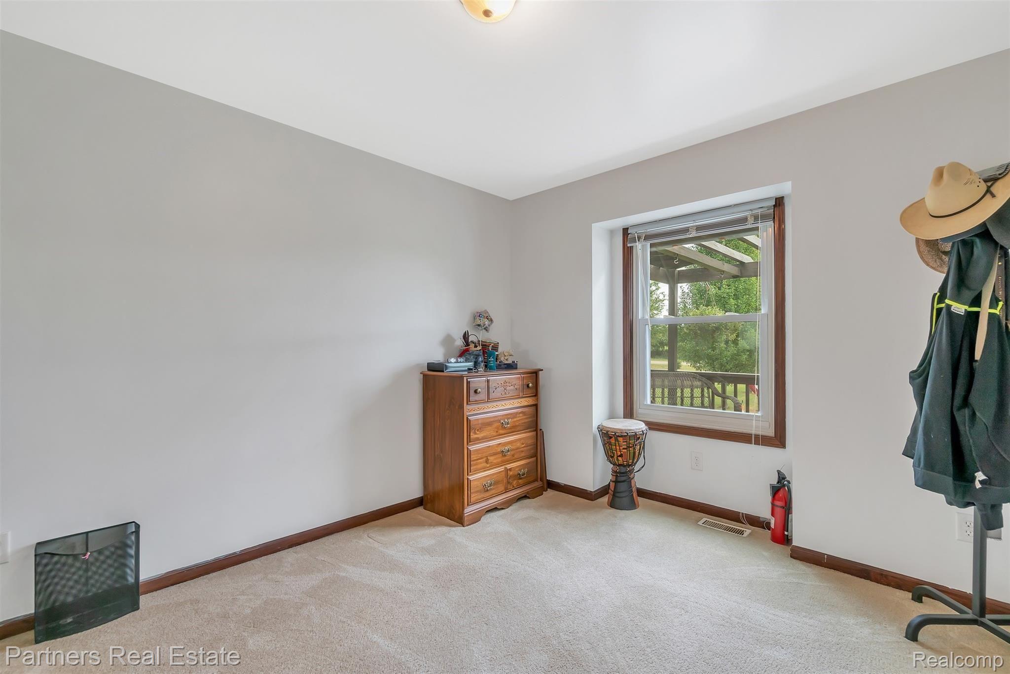 9637 North Marsh Road Fowlerville, MI 48836 - Photo 27 of 46 19-9637 N Marsh Rd-windowstill-real.jpg