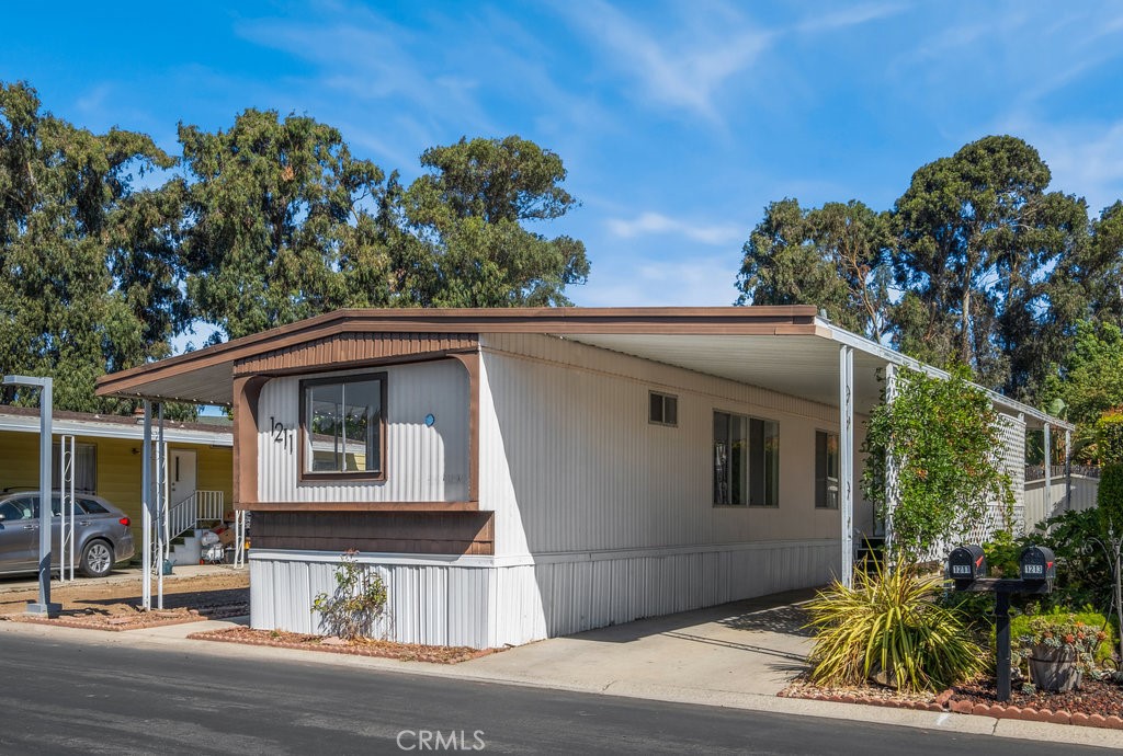 1211 Via Asueto Santa Maria, CA 93454 - Photo 1 of 20 a front view of a house with a garden