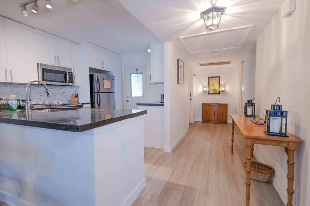 a bedroom with two beds and a window