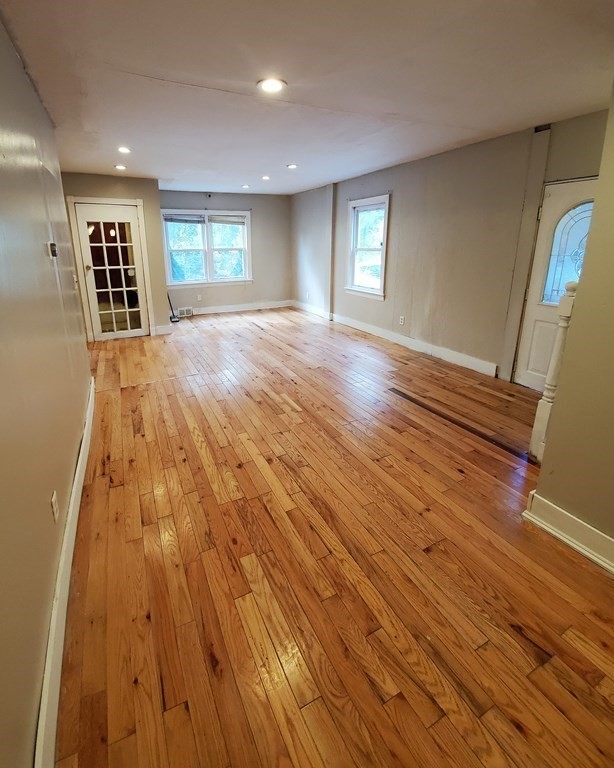 248 Ashby Road Ashburnham, MA 01430 - Photo 8 of 36 a view of wooden floor and windows in a room