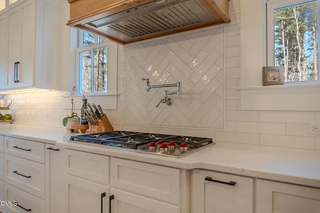 a bedroom with a bed and a wooden floor
