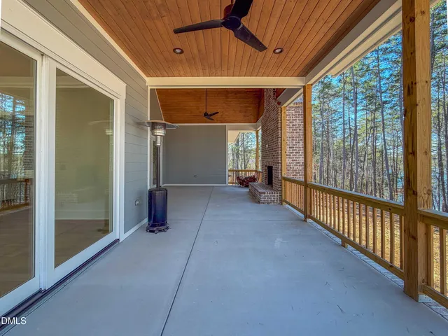 a bathroom with a granite countertop sink a mirror and a shower